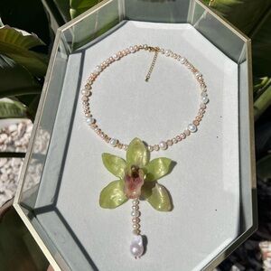Elegant Pearl and Green Orchid Necklace
